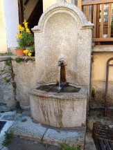 a stone fountain in saint martin vesubie